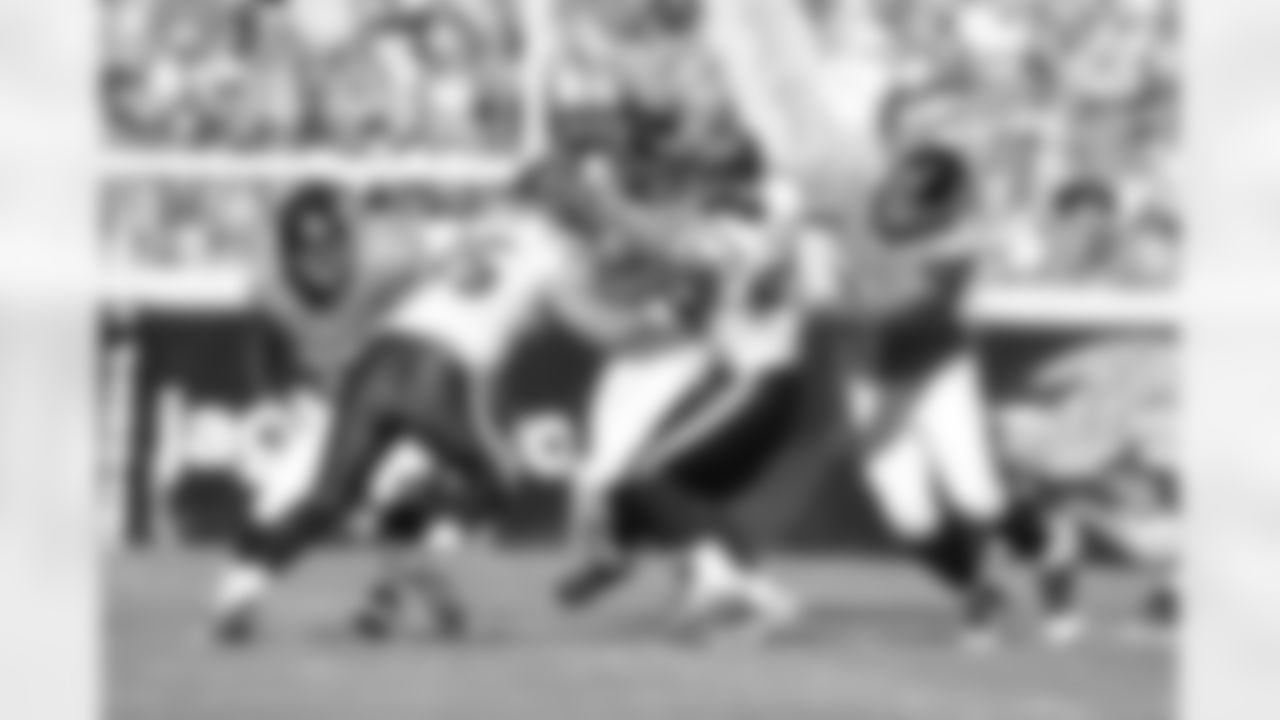 63 Brad Meester, #9 David Garrard, #67 Vince Manuwai