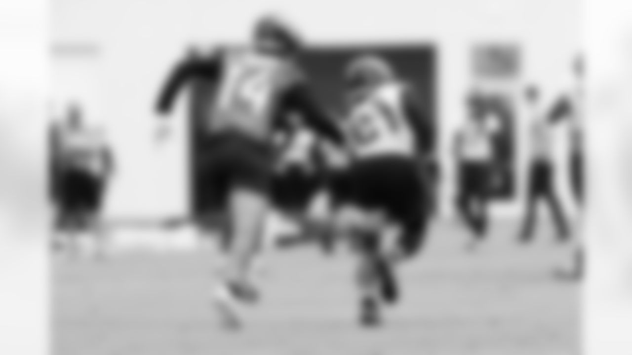 WR Elijah Cooks (14) and CB Christian Braswell (21)