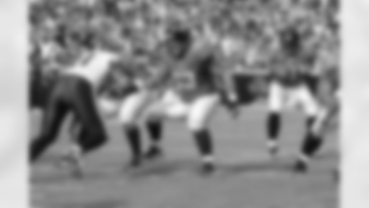 63 Brad Meester, #9 David Garrard