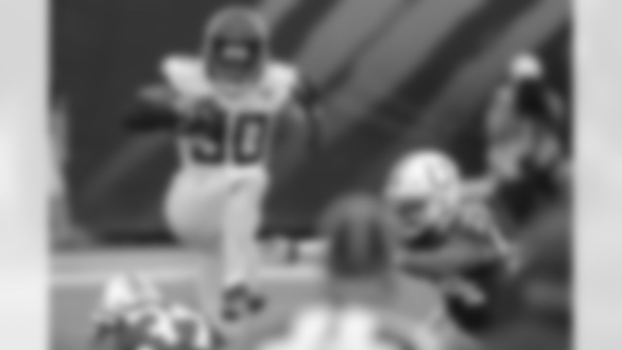 Jacksonville Jaguars rookie free agent running back James Robinson (30) hurdles a couple of Indianapolis Colts would be tacklers after a catch with 8:56 to play in the fourth quarter during an NFL football game, Sunday, September 13, 2020 in Jacksonville, Fla.