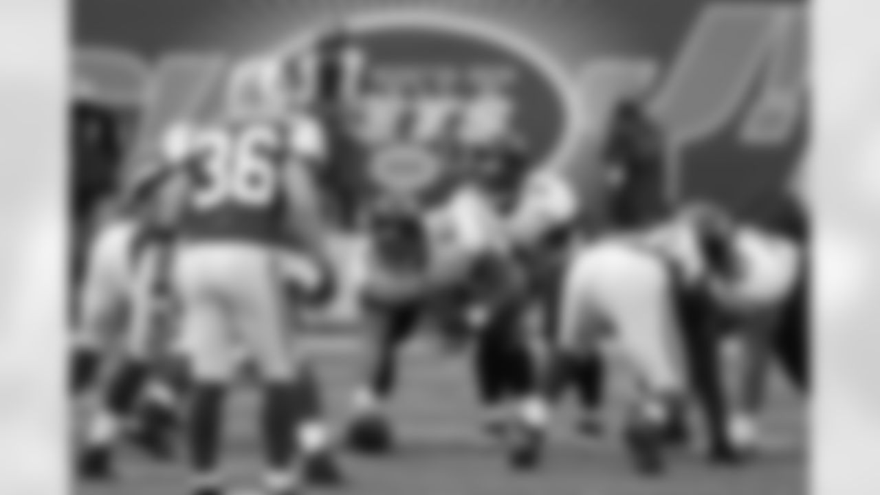 63 Brad Meester, #9 David Garrard