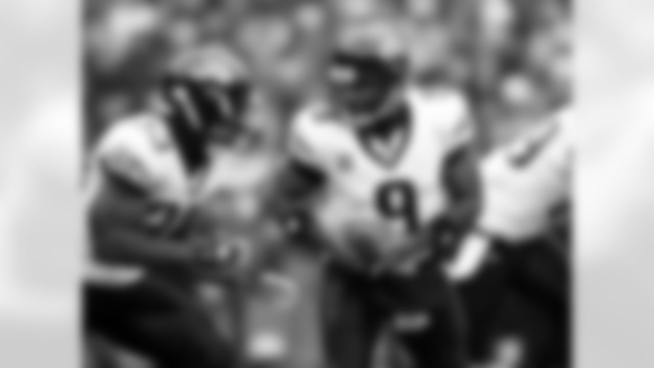 33 Greg Jones, #9 David Garrard