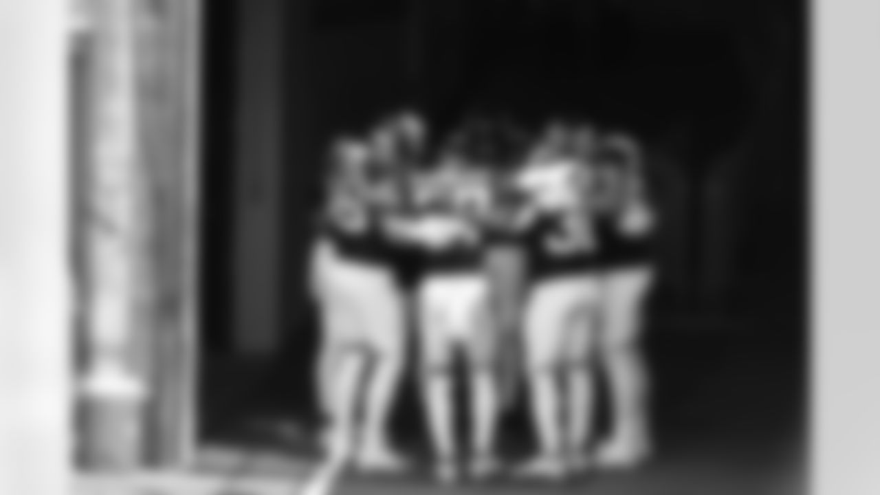 Jacksonville Jaguars players huddle together before coming onto the field to warm up for an NFL football game against the Tennessee Titans Sunday, Sept. 20, 2020, in Nashville, Tenn. (AP Photo/Wade Payne)