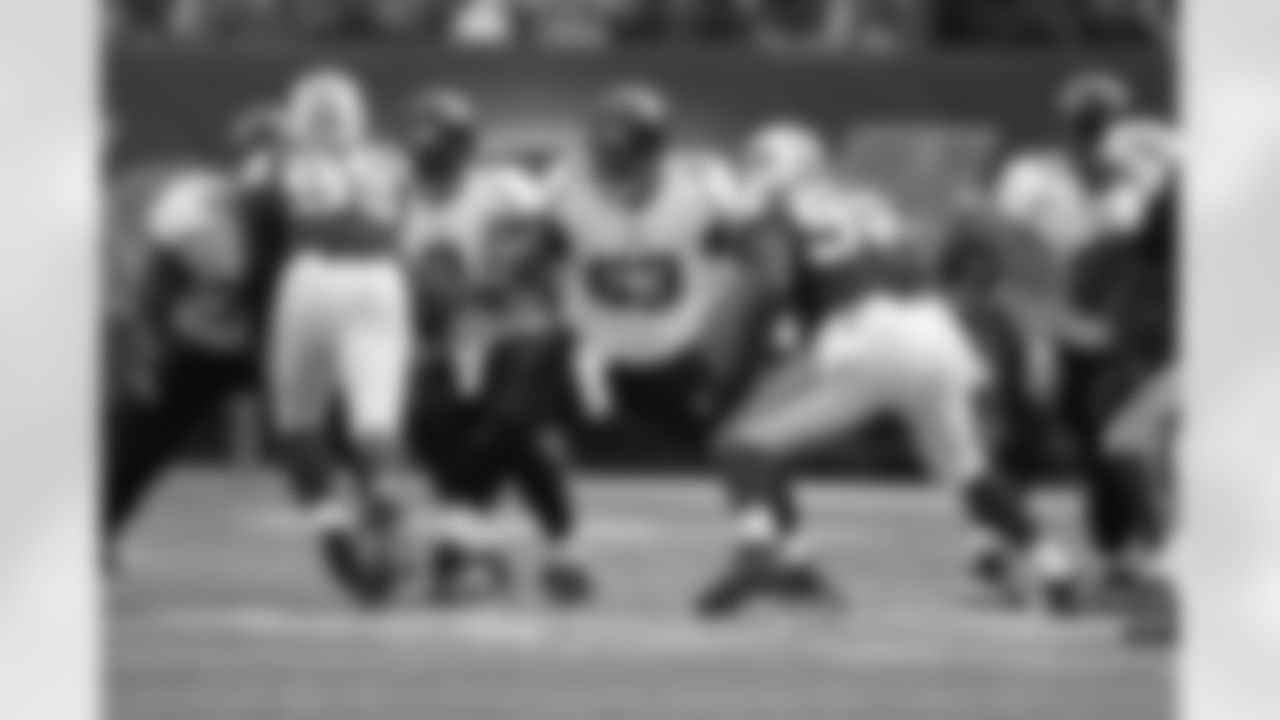63 Brad Meester, #9 David Garrard