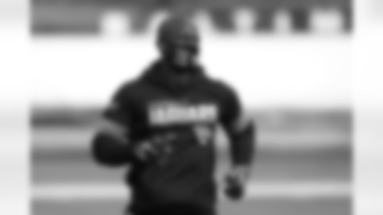 Tim Owens, Jacksonville Jaguars player engagement and youth football manager, wears a face mask to protect against COVID-19 with a message while working out with players prior to an NFL football game against the Baltimore Ravens, Sunday, Dec. 20, 2020, in Baltimore. (AP Photo/Nick Wass)