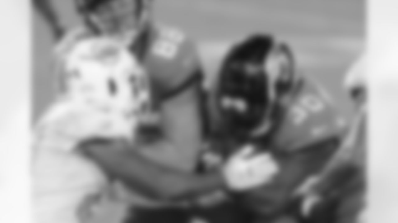 Jacksonville Jaguars rookie free agent running back James Robinson (30) gets a block from tight end Tyler Eifert (88) as he runs for an 11 yard touchdown in the second quarter against the Miami Dolphins during an NFL football game, Thursday, Sept. 24, 2020 in Jacksonville, Fla.