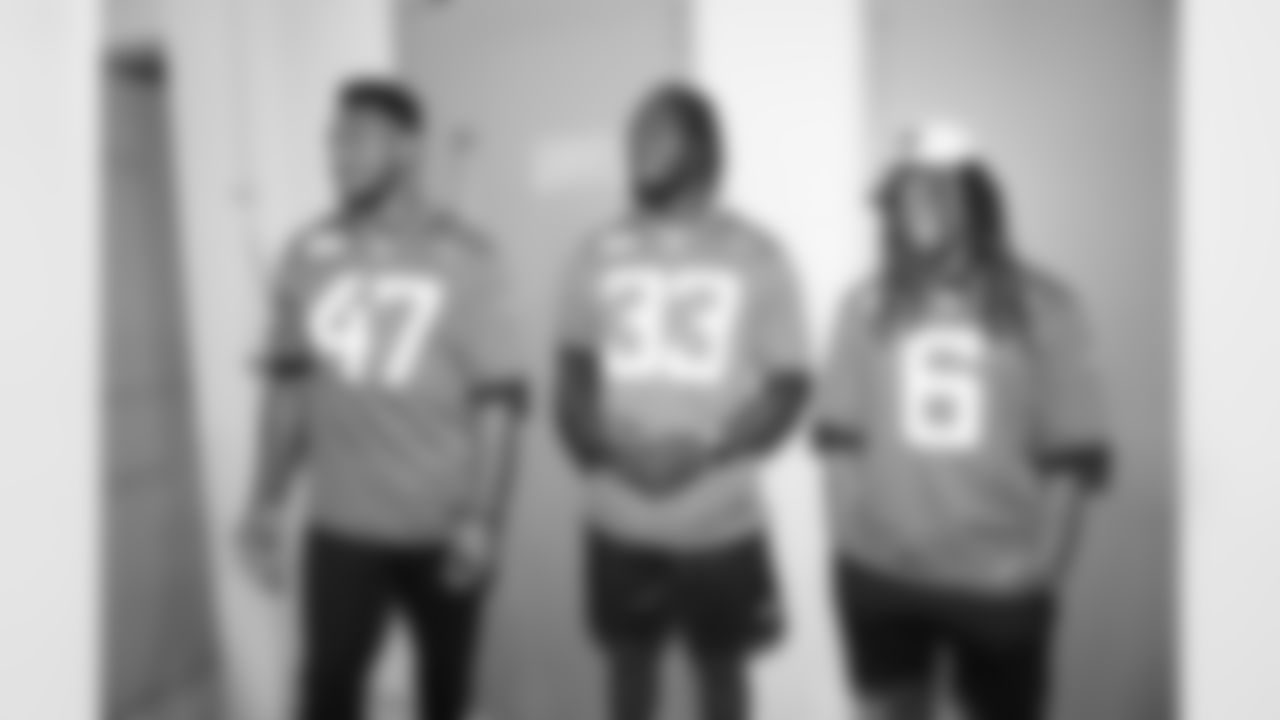 Jaguars LB Devin Lloyd (33), OLB De'Shaan Dixon (47) and CB Chris Claybrooks (6) tour NAS JAX military base on June 9, 2023.