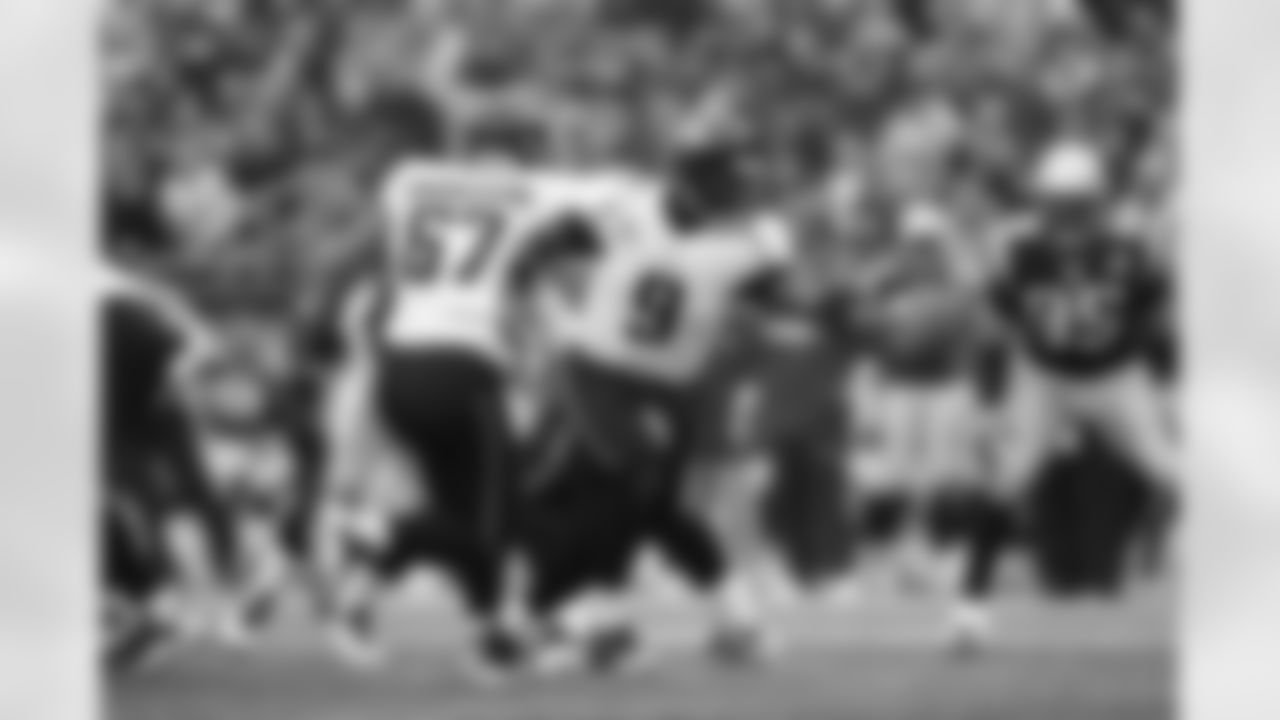 67 Vince Manuwai, #9 David Garrard