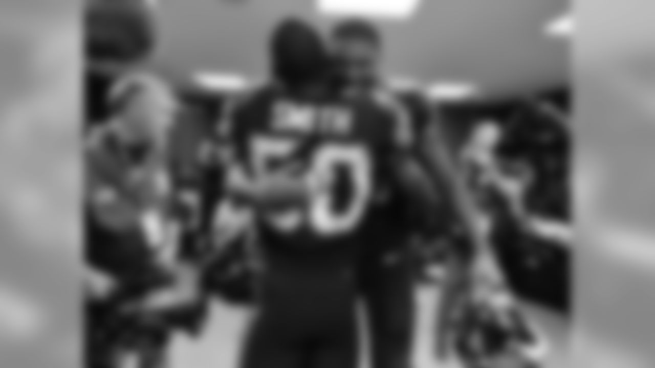 Jacksonville Jaguars defensive end Calais Campbell (93) hugs linebacker Telvin Smith (50) in the locker room following the Jags 44-7 victory against the Baltimore Ravens in an NFL game Sunday, September 24, 2017 in London, U.K. (Rick Wilson via AP)