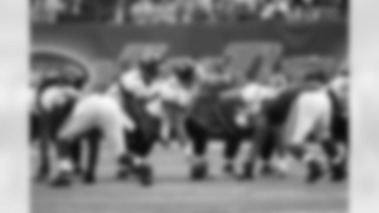 63 Brad Meester, #9 David Garrard
