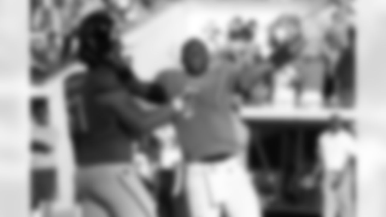 67 Vince Manuwai, #9 David Garrard
