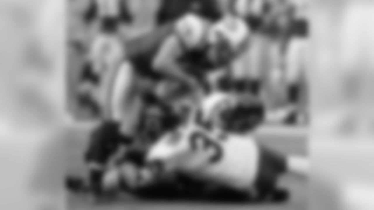 New York Jets' Tim Dwight, left, is brought down by Chicago Bears' Todd Johnson (35) and Lance Briggs during the second quarter in NFL football action Sunday, Nov. 19, 2006 in East Rutherford, N.J. (AP Photo/Julie Jacobson)
