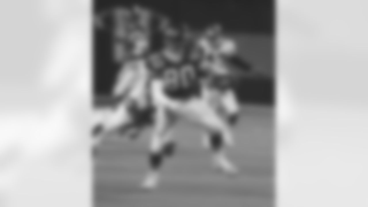 Playing in the Meadowlands on Monday night, 9/24/90, TE Mark Boyer runs through a would-be tackler during a 37-14 Jets loss.