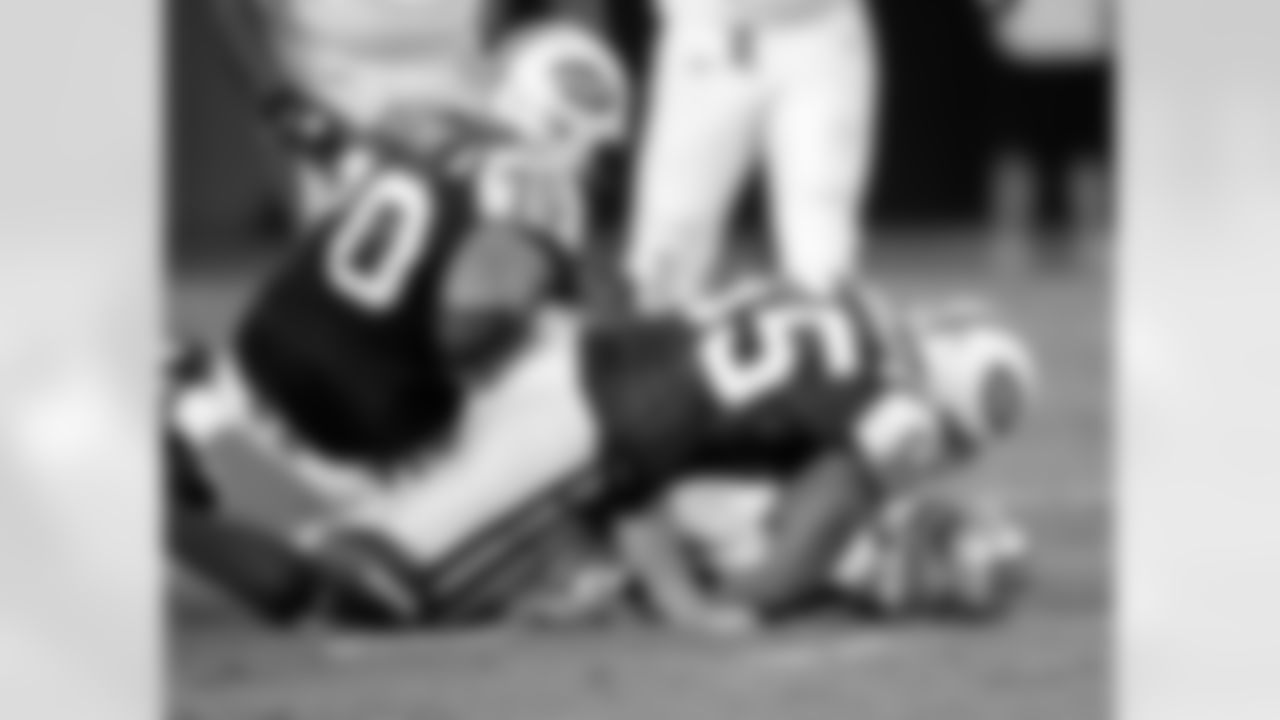 Carolina Panthers' Jimmy Clausen, bottom, loses the ball as he is sacked by New York Jets' Jamaal Westerman (55) and Mike Devito (70) in the fourth quarter of the Jets' 9-3 win in a preseason NFL football game in Charlotte, N.C., Saturday, Aug. 21, 2010. The play was ruled dead and the Panthers retained the ball. (AP Photo/Rick Havner)