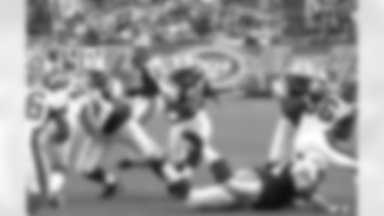 O-linemen Kevin Mawae, Brent Smith and Jerald Sowell pave the way for Hall of Fame RB Curtis Martin as he rushed for 77 yards in a 30-3 Jets win over the Bills on 10/12/03.