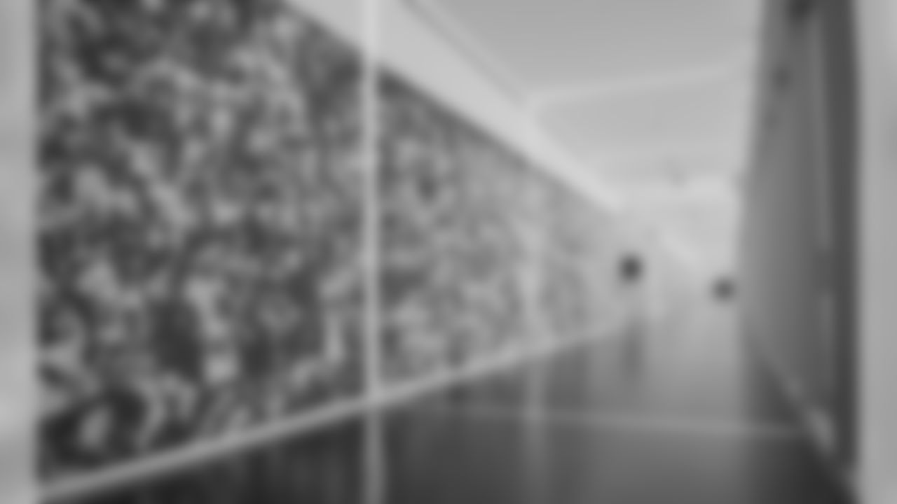 The hallway on the first floor spans the length of the outdoor turf field -- allowing visiting prospects to really take in their potential new home.