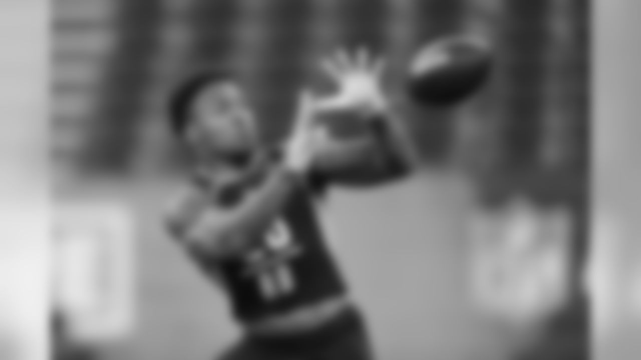 Texas A&M running back Trayveon Williams runs a drill at the NFL football scouting combine in Indianapolis, Friday, March 1, 2019. (AP Photo/Michael Conroy)