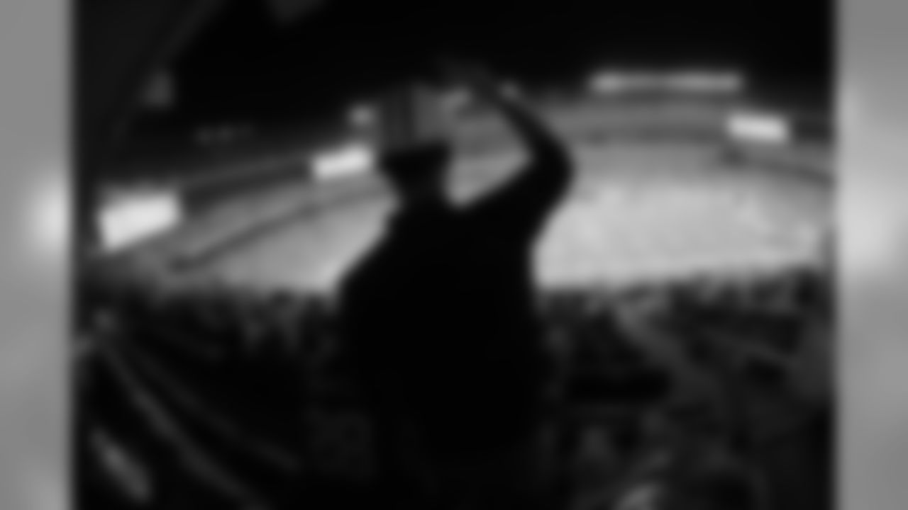 Silhouetted fans in the stands at New Meadowlands Stadium during the NFL football game between the New York Jets and Washington Redskins in East Rutherford, N.J., Friday, Aug. 27, 2010. The Redskins beat the Jets 16-11. (AP Photo/David Drapkin)