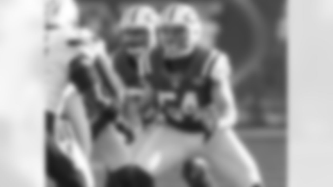 As a restricted free agent, it's possible that No. 54 Nick Bellore will return next season. The man in green and white standing behind him, however, is Eric Smith. He will be back with the Jets only this time he'll be on the sidelines as a special teams intern.