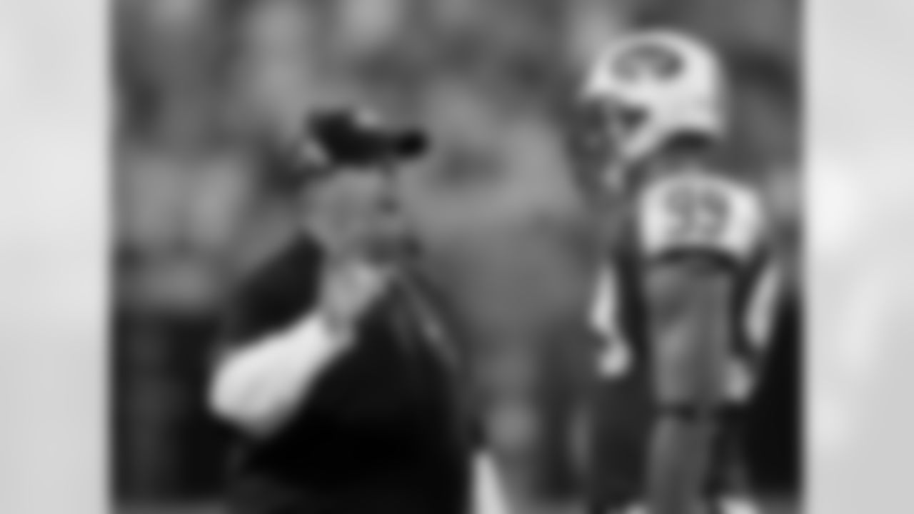 New York Jets head coach Rex Ryan, left, talks with Bryan Thomas (99) in the second quarter of a preseason NFL football game against the Carolina Panthers in Charlotte, N.C., Saturday, Aug. 21, 2010. (AP Photo/Chuck Burton)