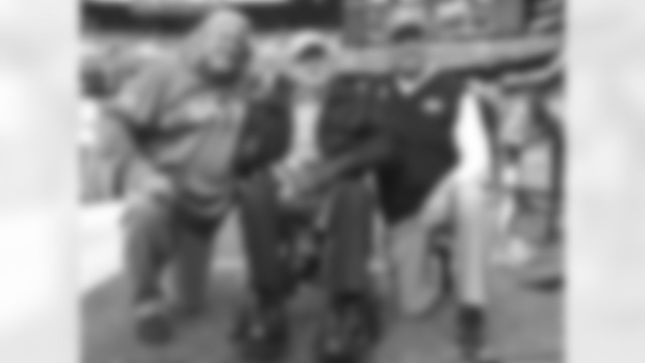 Buddy Ryan (center) poses for a picture with his twin boys, Rob (left) and Rex (right) prior to the Jets-Saints game. "I pull for them every single week except one," Rex said after the Jets won 26-20.