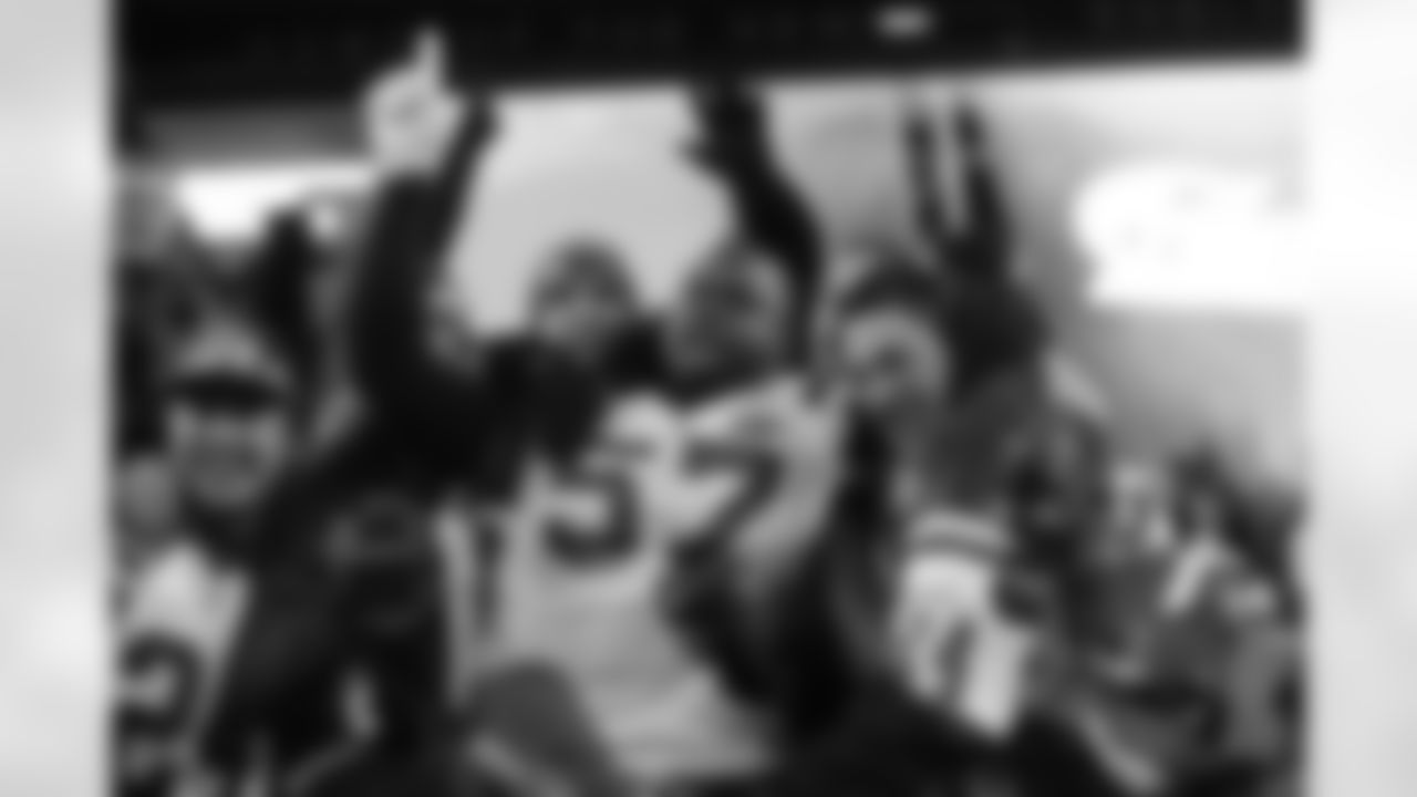 Scott celebrating with fans in New England after defeating the Patriots in the 2010 Divisional Round Playoffs
