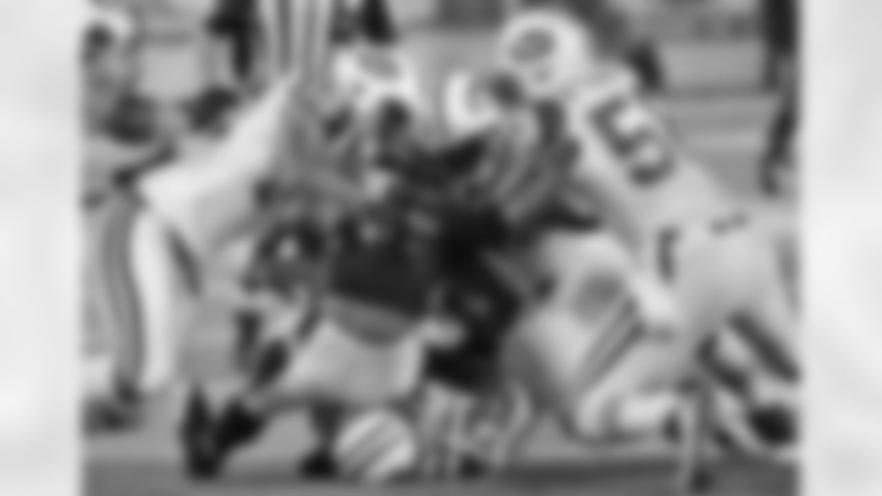 A host of New York Jet defenders, including DE Vernon Gholston (50) and OLB Bryan Thomas (58) stop RB Willis McGahee and force a fumble during our Monday night season opening loss on 9/13/10.