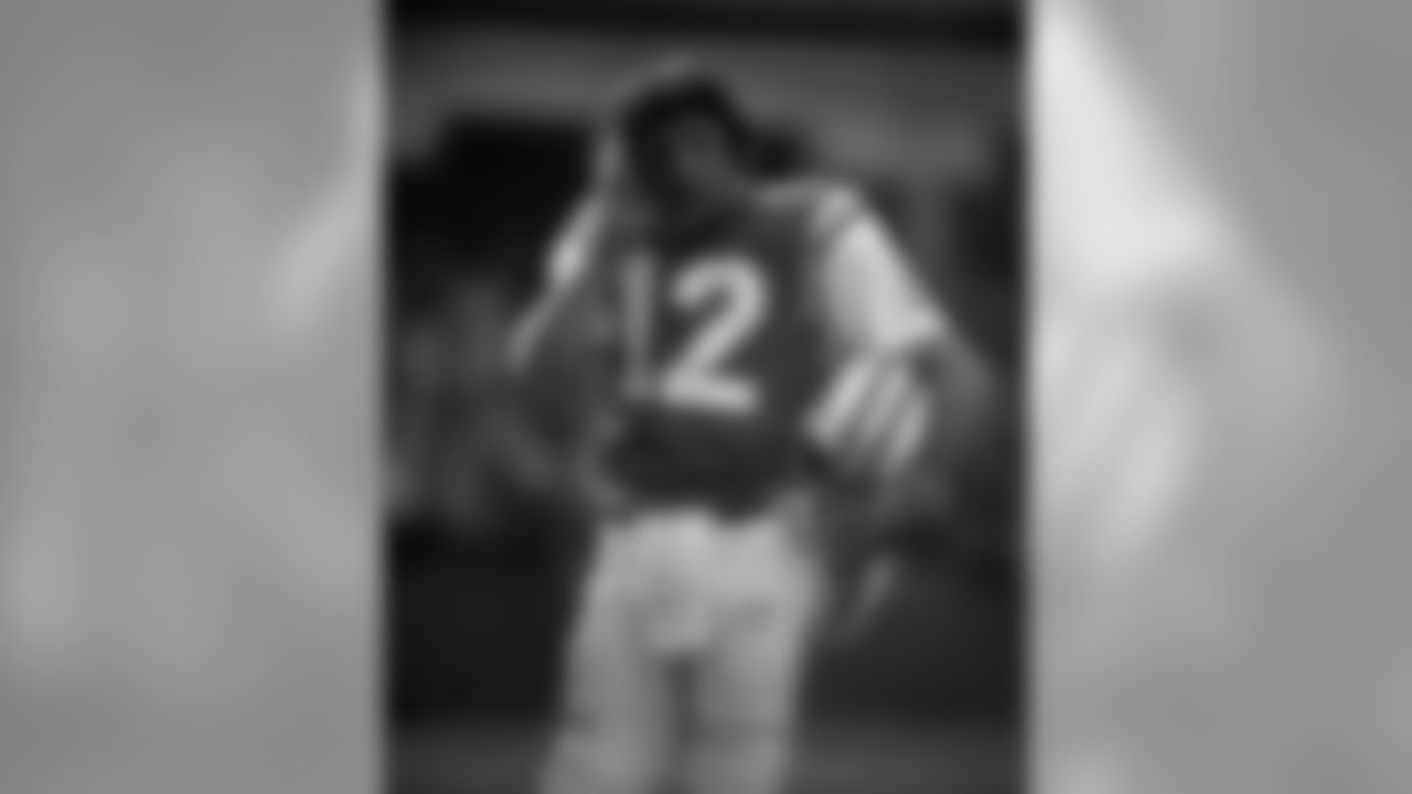New York Jets quarterback Joe Namath on the phone on the sideline. Joe Namath - New York Jets - File Photos (AP Photo/NFL Photos)