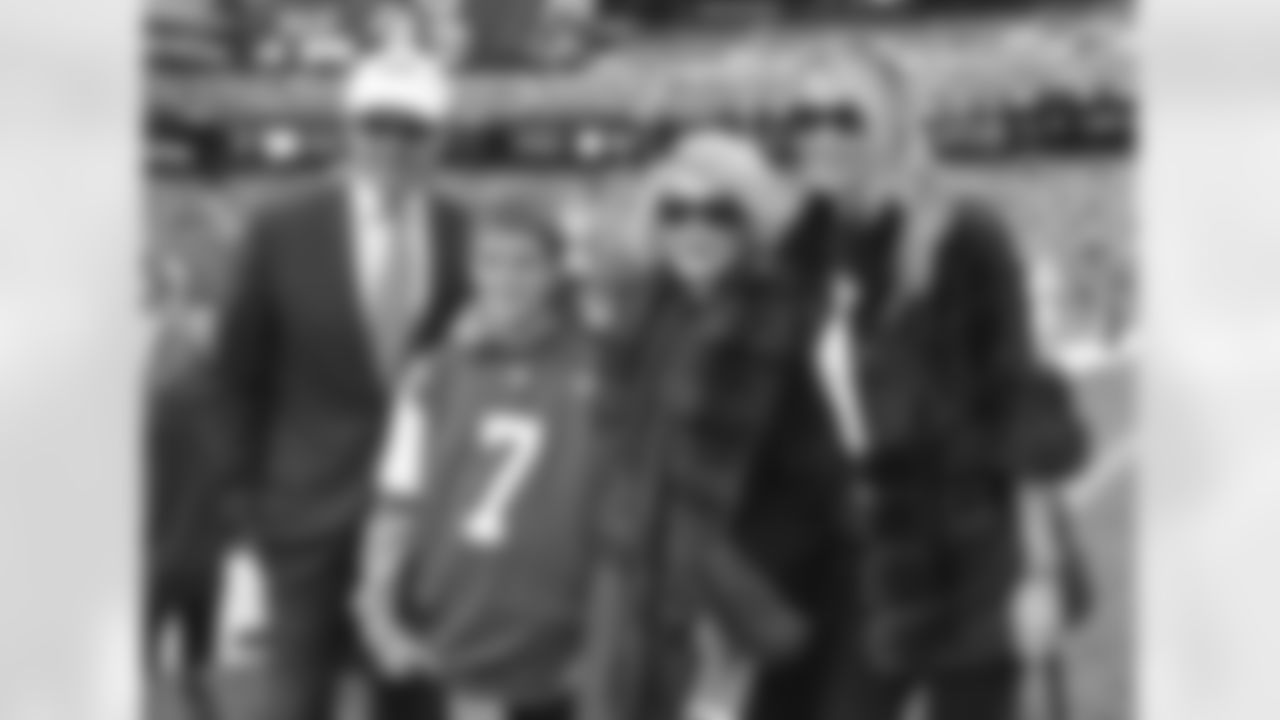 TV Personality Joan Rivers poses for a photo with Jets owner Woody Johnson and his wife Suzanne.