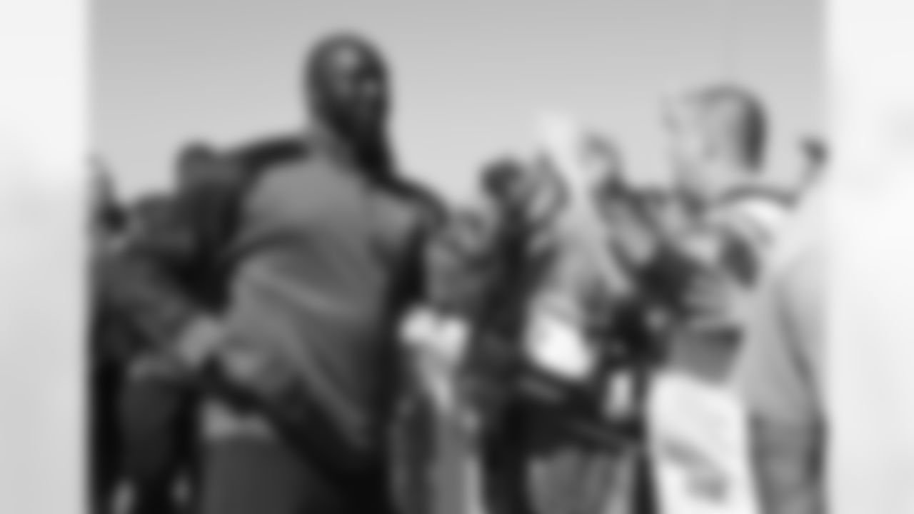 DE Muhammad Wilkerson and the rest of the team parade through the crowd toward the MetLife Central gate just hours before kickoff.