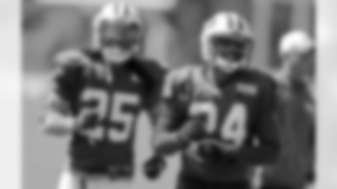 New York Jets defensive back Darrelle Revis (24) and Calvin Pryor (25) smile as they take part in drills during practice at NFL football training camp, Tuesday, Aug. 4, 2015, in Florham Park, N.J. (AP Photo/Frank Franklin II)