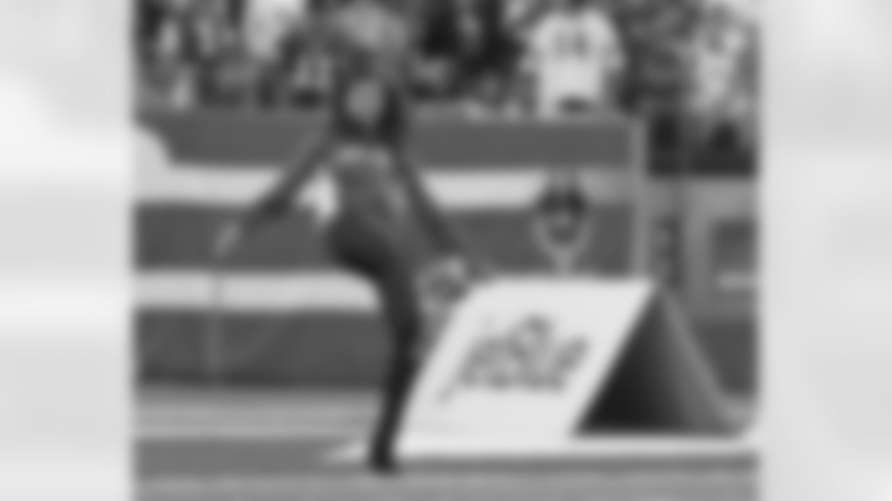 This fan does her best Ryan Quigley during the JetBlue Punt Challenge.