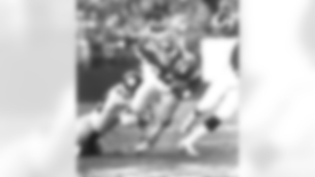 RB Freeman McNeil wins the battle, breaking free from this would-be tackler, but the Steelers win the war by a score of 34-7 on 12/10/83.