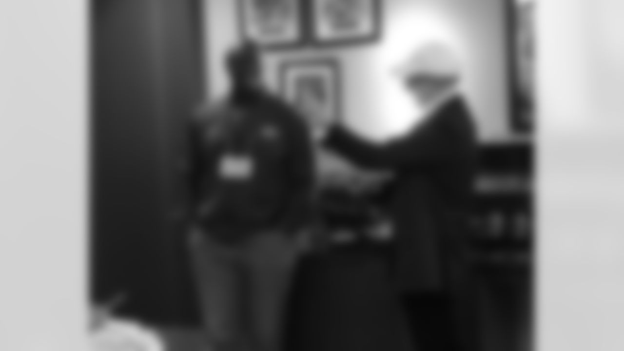 Coach Bowles talking with Owner Woody Johnson