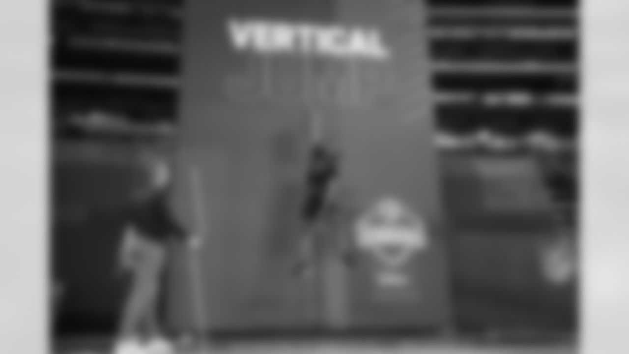 Virginia Tech defensive lineman Amaré Barno leaps during the vertical jump at the NFL football scouting combine, Saturday, March 5, 2022, in Indianapolis. (AP Photo/Charlie Neibergall)