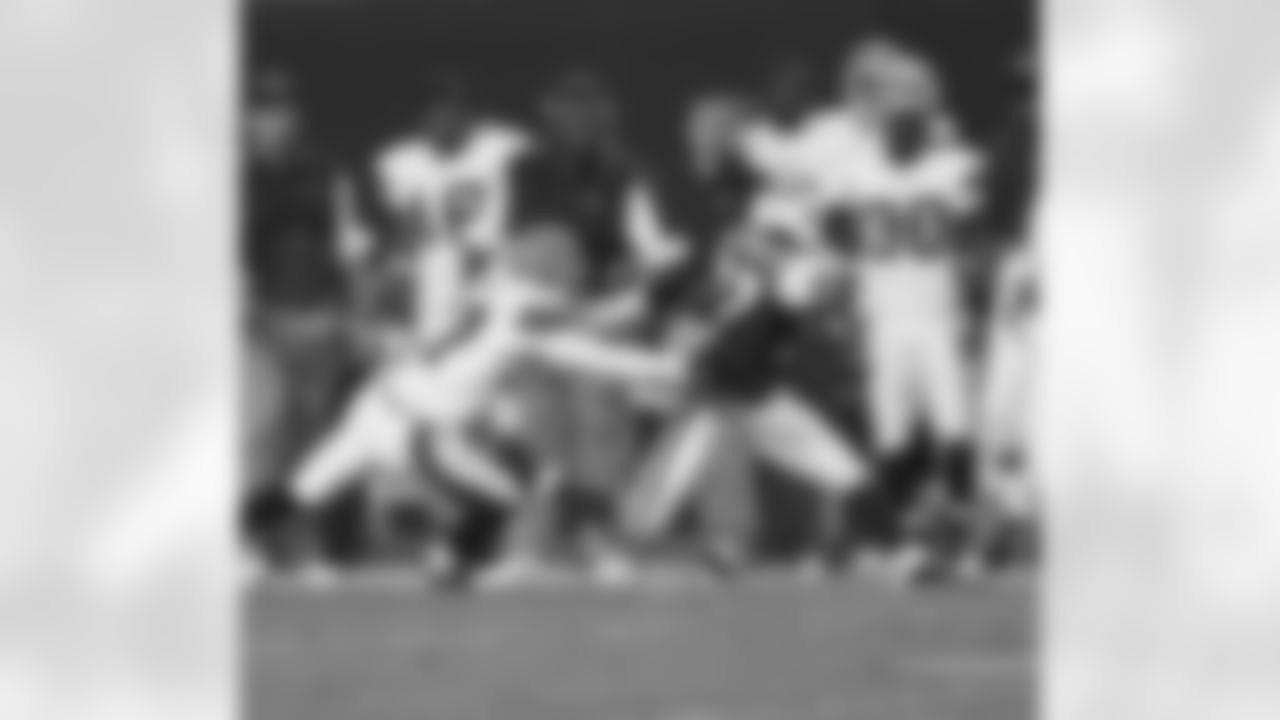 WR David Clowney sprints down the sideline and tries to break free from the grasp of a Cleveland Brown defensive back.