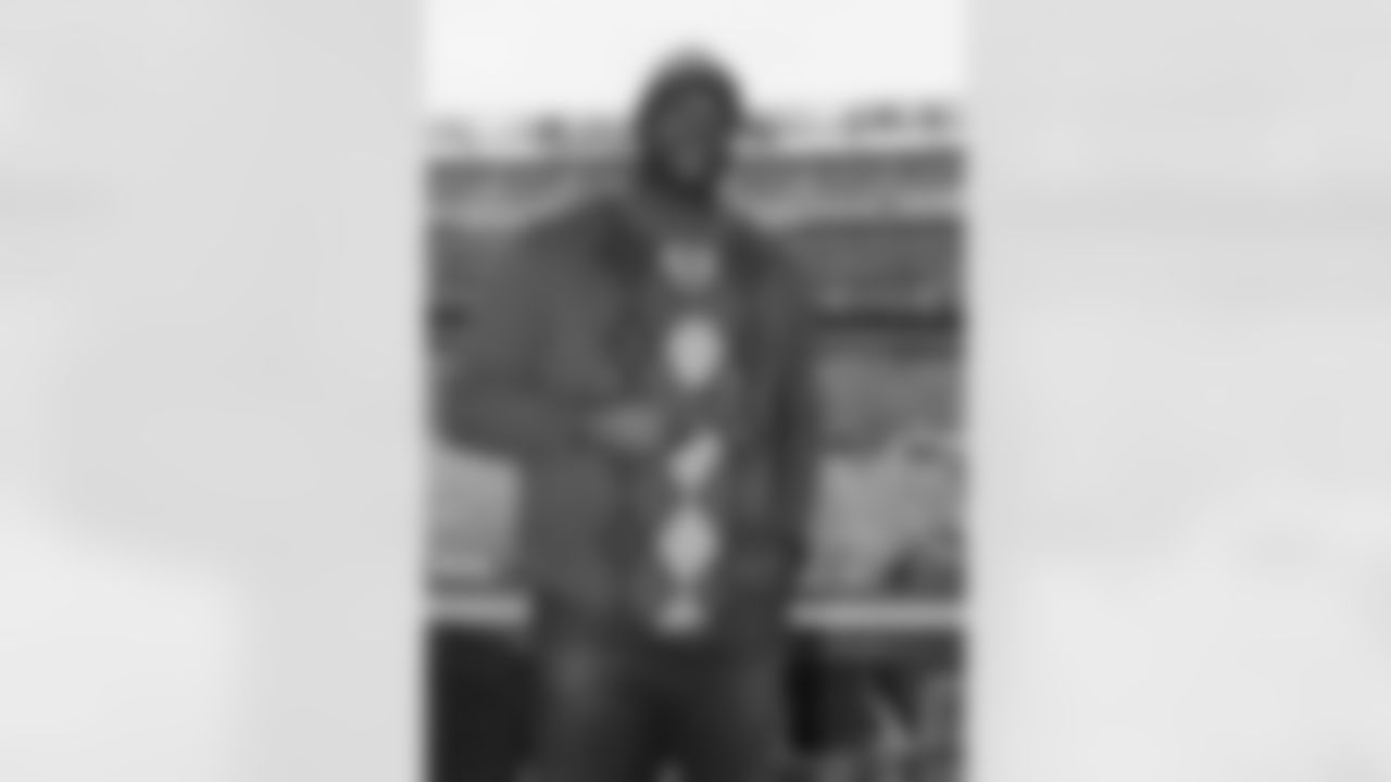 Shaquille O'Neal poses for a photo overlooking the field before the Super Bowl.