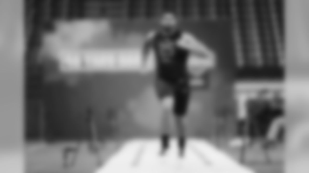Iowa defensive lineman A J Epenesa runs the 40-yard dash at the NFL football scouting combine in Indianapolis, Saturday, Feb. 29, 2020. (AP Photo/Charlie Neibergall)