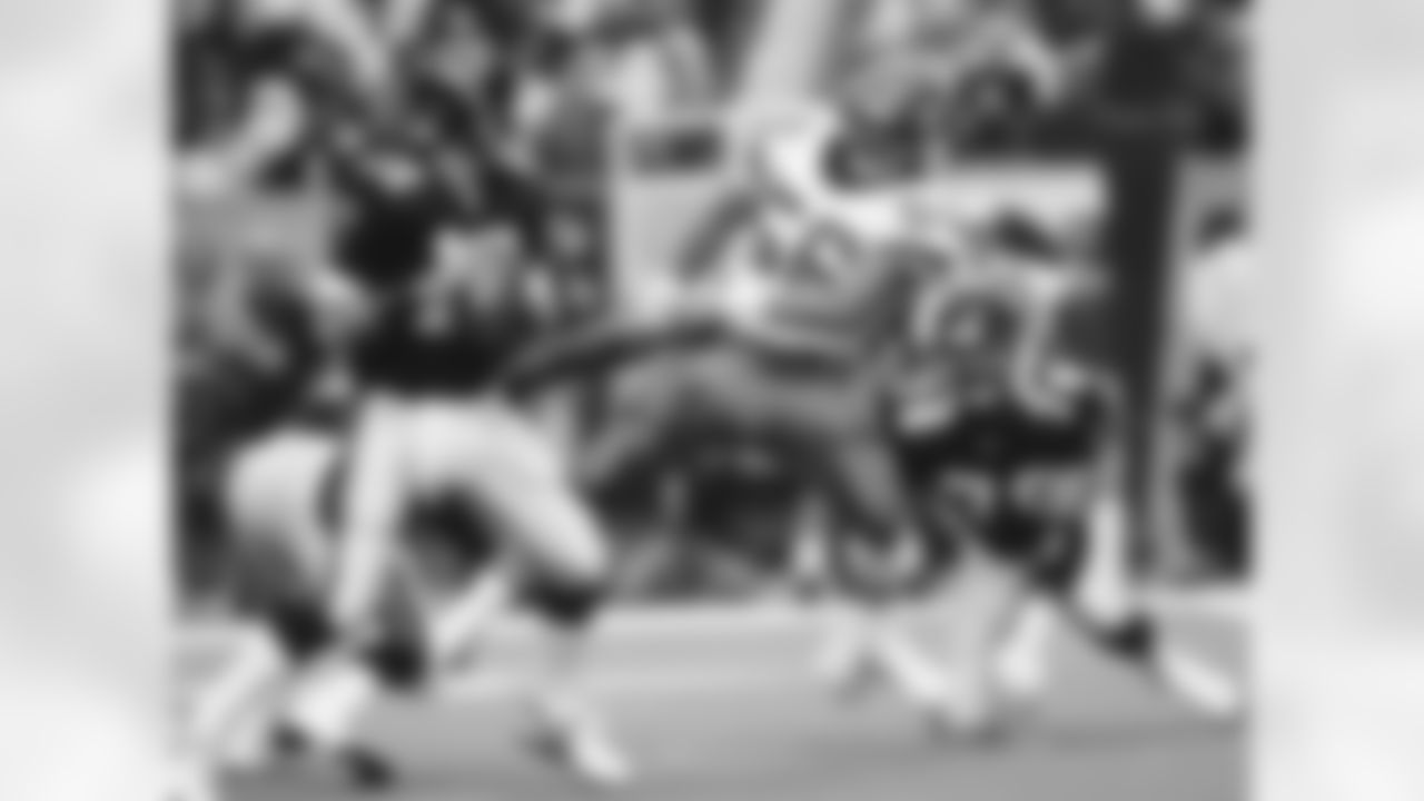 DE Jeff Lageman rushes toward QB Chris Miller in a season-opening loss for the Green & White, 20-17 at the Georgia Dome on 9/6/92.