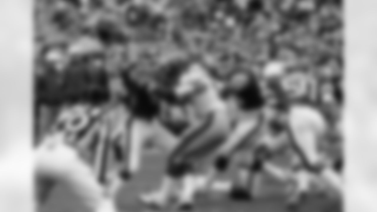 Falcons QB Steve Bartkowski fails to duck under the bodies of DB Ken Schroy (left) and DE Mark Gastineau (right) at Shea Stadium on 10/23/83.