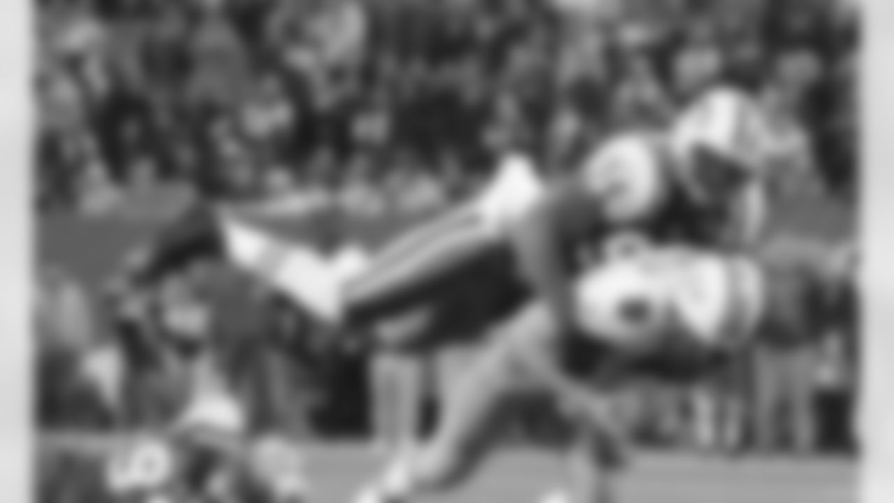 DE John Abraham does his best Superman impression before bringing QB Jay Fiedler with him on his way back down. Abraham was our last double-digit sacker in '05 before DE Muhammad Wilkerson and LB Calvin Pace joined the club this season.