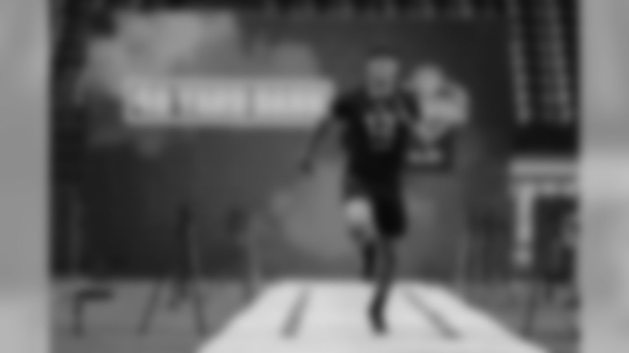 Hawaii quarterback Cole McDonald runs the 40-yard dash at the NFL football scouting combine in Indianapolis, Thursday, Feb. 27, 2020. (AP Photo/Michael Conroy)