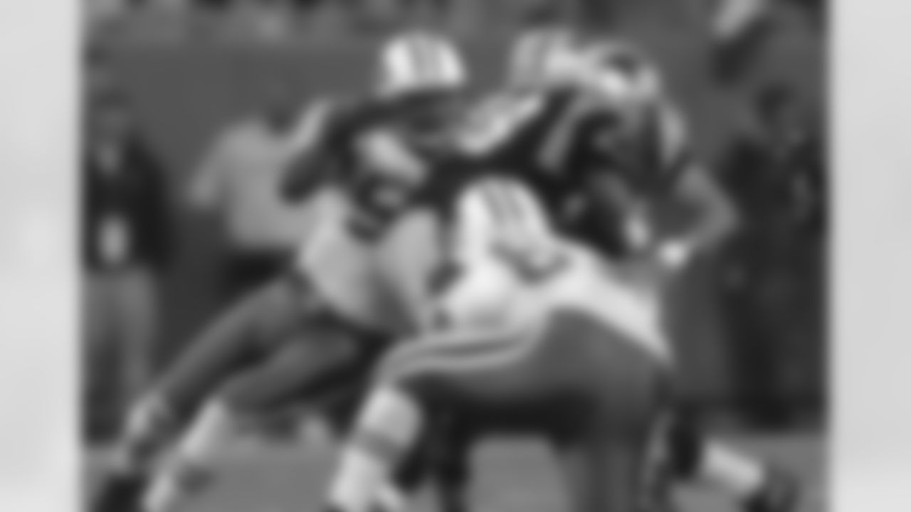DE John Abraham records one of his six tackles in a game that got away from the Jets in the fourth quarter, a 30-3 loss to the Panthers on 11/13/05.