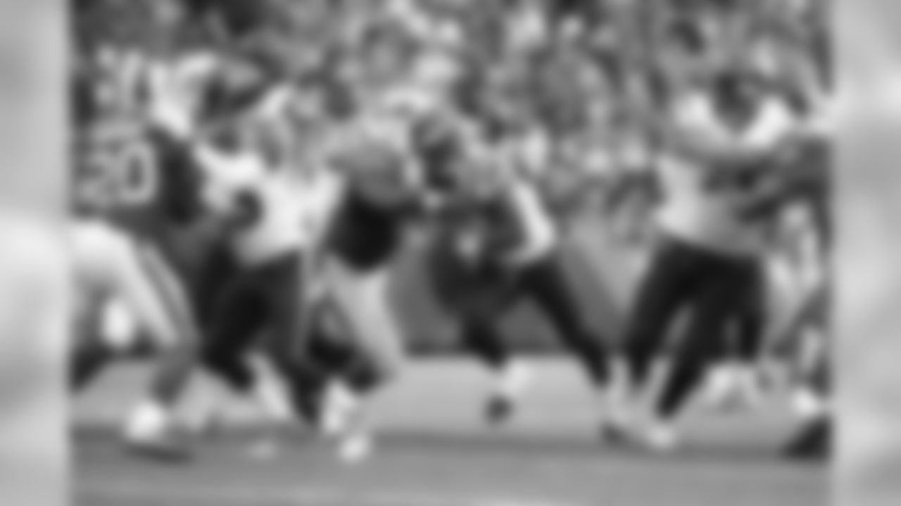 Houston Texans running back Alfred Blue (28) carries the ball between blockers Oday Aboushi (78) and Nate Washington (85) as the Bills defensive tackle Corbin Bryant (97) looks to wrap him up for the tackle during a Week 13 NFL football game against the Buffalo Bills on Sunday, Dec. 6, 2015, in Orchard Park, N.Y. The Bills beat the Texans 30-21. (Matt Patterson via AP)