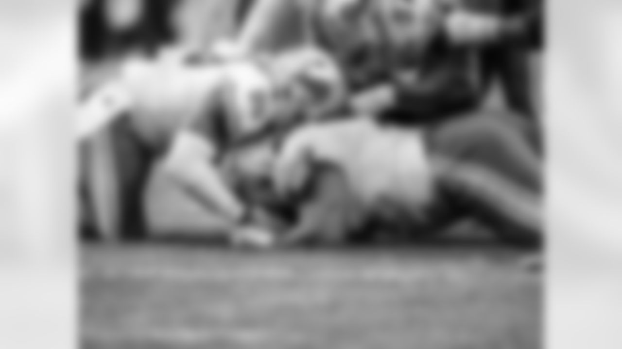 Detroit Lions defensive lineman John Penisini (91) recovers a fumble during an NFL football game against the Chicago Bears on Sunday, Dec. 6, 2020 in Chicago, IL. (Detroit Lions via AP).