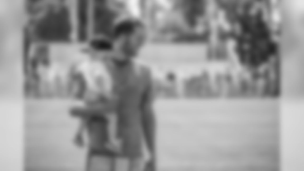 Detroit Lions quarterback Matthew Stafford spends time with his daughter following training camp practice on Sunday, July 29, 2018 in Allen Park, Mich. (Detroit Lions via AP)