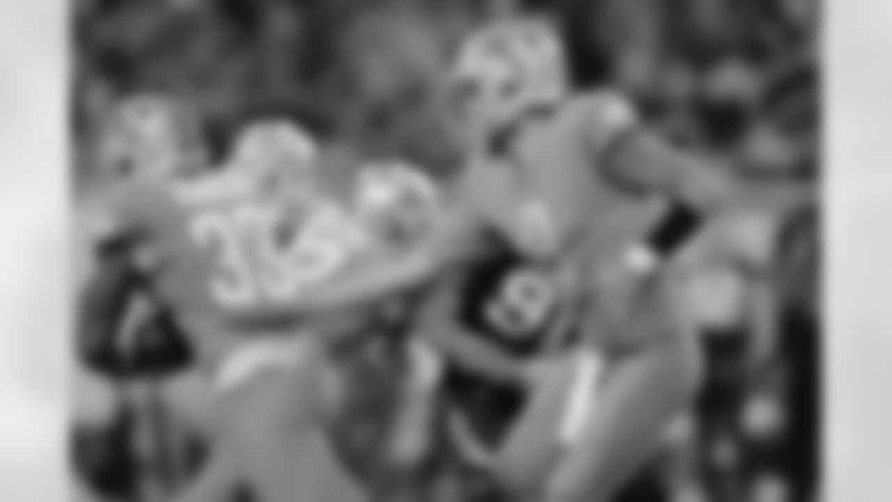 Detroit Lions quarterback Matthew Stafford (9) hands off to Detroit Lions running back Kerryon Johnson (33) during a NFL football game against the Carolina Panthers on Sunday, Nov. 18, 2018 in Detroit. (Detroit Lions via AP).