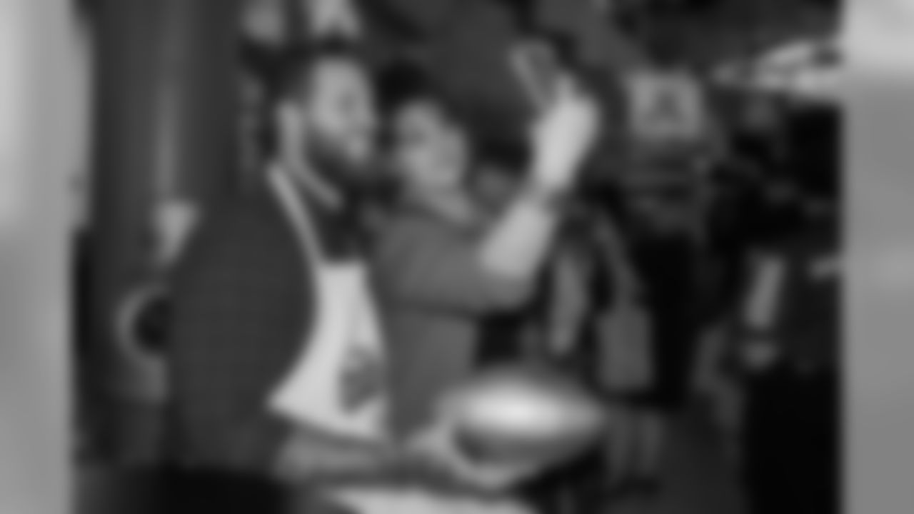 Taylor Decker takes a selfie with a fan at Taste of the Lions on Wednesday, May 15, 2019 in Detroit.