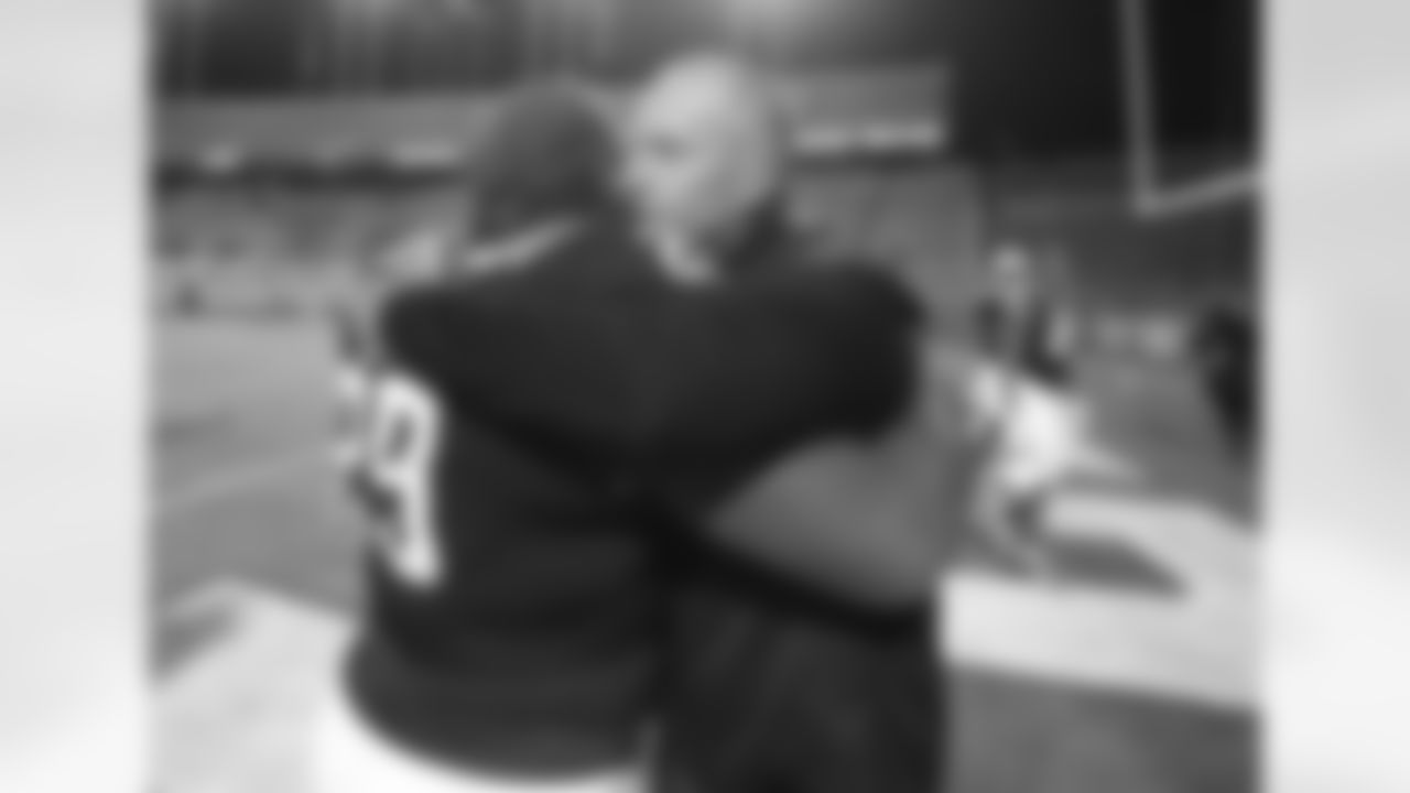 North Carolina State coach Dave Doeren hugs defensive tackle Alim McNeill (29) after the team's 23-13 victory over Georgia Tech in an NCAA college football game in Raleigh, N.C., Saturday, Dec. 5, 2020. (Ethan Hyman/The News & Observer via AP, Pool)