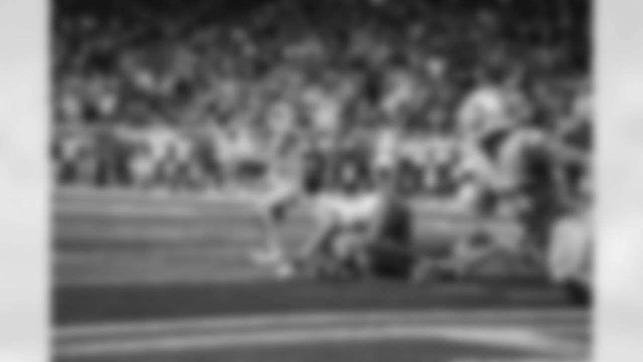 Detroit Lions quarterback Jared Goff (16) throws a touchdown pass to Detroit Lions wide receiver Amon-Ra St. Brown (14) during a NFL football game against the Buffalo Bills on Thursday, November 24, 2022 in Detroit, MI. (Jeff Nguyen/Detroit Lions).